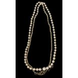 A string of graduated cultured pearls, with diamond set clasp, the pearls measure from approx 2.28mm