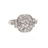 An art Deco style diamond set cluster ring, comprising central brilliant cut diamond weighing approx