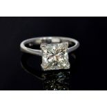 A diamond solitaire 18ct white gold ring, the princess cut diamond accompanied by and E.G.L report