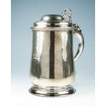 A George II plain silver tankard, the domed cover with cast openwork thumbpiece and S-scroll handle,