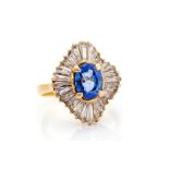 A sapphire and diamond fancy quatrafoil shaped cluster ring, the central oval cut blue sapphire