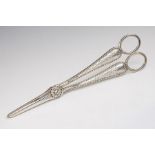 A pair of Victorian silver grape scissors, the stem engraved with foliage, by HJ Lias & Son,