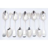 A set of twelve Victorian Scottish silver Fiddle pattern dessert spoons, each engraved with