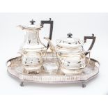An early 20th Century silver matched four-piece tea and coffee service, Georgian style with