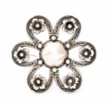Niels Erik From-  A Danish modernist silver brooch, in the form of a flower, the petals comprised of