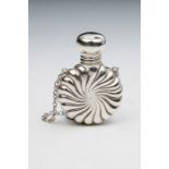 A Victorian small silver circular perfume bottle, radial wyvern fluted, on suspension ring, London