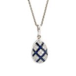 Faberge, an 18ct white gold, diamond, sapphire and enamel egg pendant, set with round brilliant-