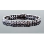 A Tiffany & Co Art Deco diamond set platinum line bracelet,  the carre-set forty-five old round-