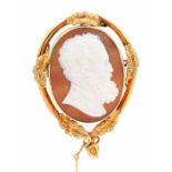 A 19th century shell cameo brooch, depicting a bearded gentleman, unmarked yellow metal surround