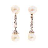 A pair of cultured pearl and diamond set drop earrings, total of four cultured pearls, comprising