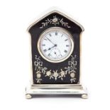 An Edwardian inlaid tortoiseshell and silver mounted desk / mantle clock, domed top on plinth base