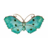An early 20th Century silver and enamel brooch, the turquoise enamel wings  decorated with orange