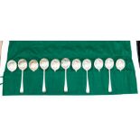 A matched set of twelve George V silver Old English Feather Edge soup spoons, each handle engraved