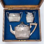 A Victorian silver tea set, comprising teapot, sugar bowl and cream jug, foliate floral and scroll