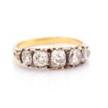 A Victorian diamond ring, comprising five graduated oval/cushion old-cut diamonds, with a