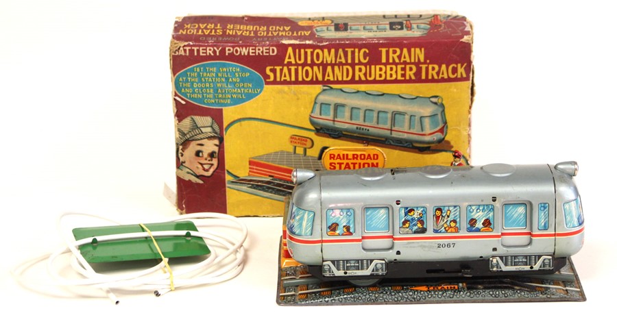 Automatic Train Station: A boxed, battery operated, tinplate, Automatic Train Station, Made by