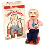 Puffy Morris: A boxed, tinplate, battery operated, Cigarette Smoker 'Puffy Morris', Made by Rosko,