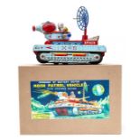 Moon Patrol: A boxed 1960's battery operated, tinplate, Moon Patrol Vehicle with Mystery Action,