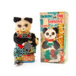 Smoking and Shoe Shining Panda Bear: A boxed, battery operated, tinplate and plush, Smoking and Shoe