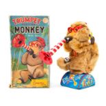 Trumpet Playing Monkey: A boxed, battery operated, tin and plush, Trumpet Playing Monkey, with a