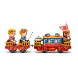 Monkey Line Train: A clockwork, tinplate, Monkey Line Train, pulling a carriage with two children
