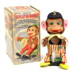 The Playing Monkey: A boxed, battery operated, tinplate, The Playing Monkey, Made by S&E, Japan,