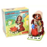 Lady Pup: A boxed, battery operated, tinplate, Lady Pup Tending Her Garden, Made by Cragston, Japan,