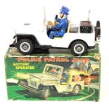 Police Patrol Jeep: A boxed, battery operated, tinplate, Police Patrol Jeep, Made by Nomura (T.N),