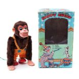 Happy Chimp: A boxed, battery operated, remote control, tin and plush, Happy Chimp, Made by