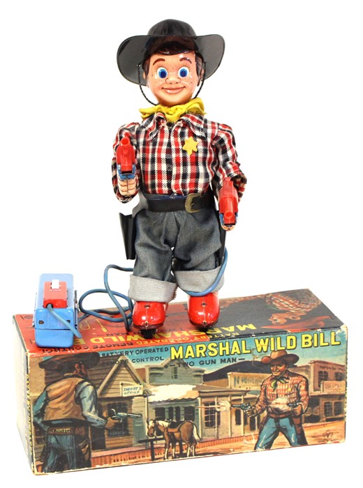 Marshal Wild Bill: A boxed, battery operated, tinplate, Marshal Wild Bill, Two Gun Man, remote