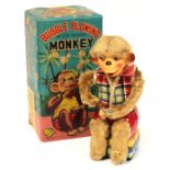 Bubble Blowing Monkey: A boxed, battery operated, tin and plush, Bubble Blowing Monkey, Made by