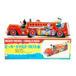 Mickey Mouse: A boxed, battery operated, tinplate, Mickey Mouse & Donald Duck Fire Engine, Made by