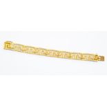 An 18k yellow gold pierced Greek Key bracelet, approx 29g