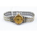 A ladies Gucci steel gold-plated bracelet watch, gold tone round dial, batons and date window,