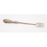 A Victorian silver toasting fork with detailed repousse handle, by Crisford & Norris, Birmingham,