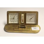 A Europa desk clock and weather station, gilt metal frame on oval base