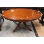 A 20th Century Mahogany inlayed oval coffee table on pedestal with quadruped base with brass/