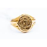 An 18ct gold monogrammed seal ring, size O, total gross weight approx. 9.9gms