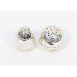 Round and egg shaped London silver pepper pots
