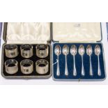 A set of six napkin rings cased, by Emile Viner, Sheffield, 1945 and a set of six spoons cased, date