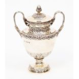 A George V silver small twin handled cup and cover, the body with borders of stylized foliate