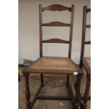 A pair of early 20th century oak canework hall chairs