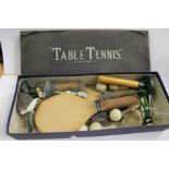 A Cavendish Wares table tennis set complete with patented posts, nets, cork handle bats, celluloid