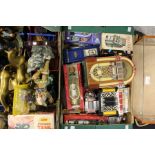 Two boxes of assorted curios to include; door knockers, novelty jukeboxes, two trucks etc