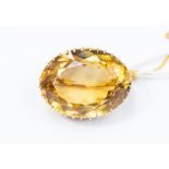 A large oval citrine brooch, the faceted citrine approx 24mm x 31mm x 13.94mm, total gross weight