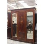 Late Victorian mahogany three door wardrobe, mirrors either side