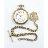 A white metal pocket watch along with a white metal chain along shield medallion
