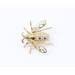 A diamond set 14ct gold brooch in the form of a Bumble Bee, the striped body set with small