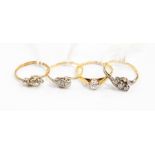 Two three-stone diamond rings, one stamped 18ct, gross weight approx 4gms; an 18ct gold solitaire