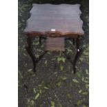 A 20th century mahogany hall table on cabriole supports with an under tier.